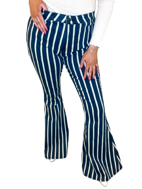 Ripped women jeans for a rebellious and fashion - forward styleStripe Flare Jeans In White & Green Pinstripe