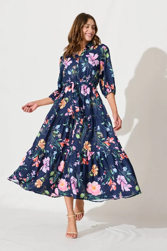 Ruffled maxi dresses with a tiered skirt for added volumeLove Song Maxi Dress In Navy With Multi Floral Print