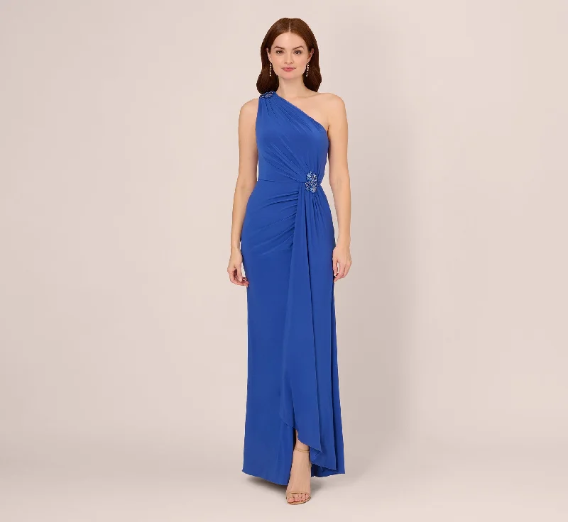 Maxi dresses with mesh panels for a sexy and trendy appearanceOne Shoulder Draped Jersey Gown With Floral Sequin Accents In Brilliant Sapphire